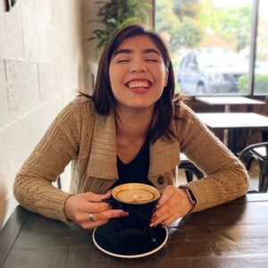 Knitted sweater with buttons and pockets.